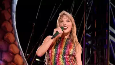 A picture of Taylor Swift Wears Snake Necklace at iHeartRadio 2025