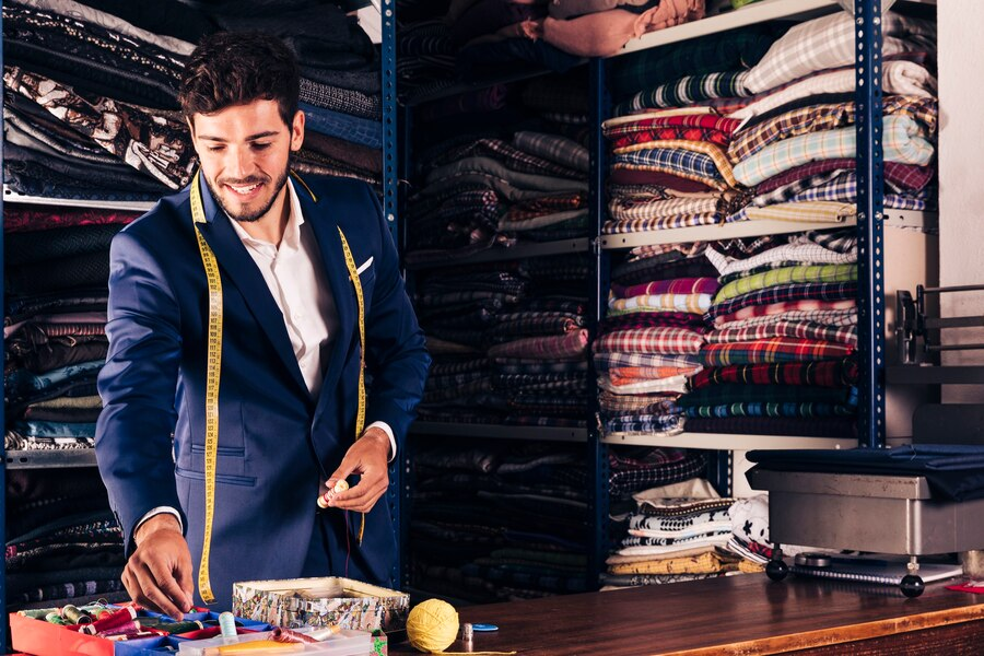 Men checking size for wedding tuxedo