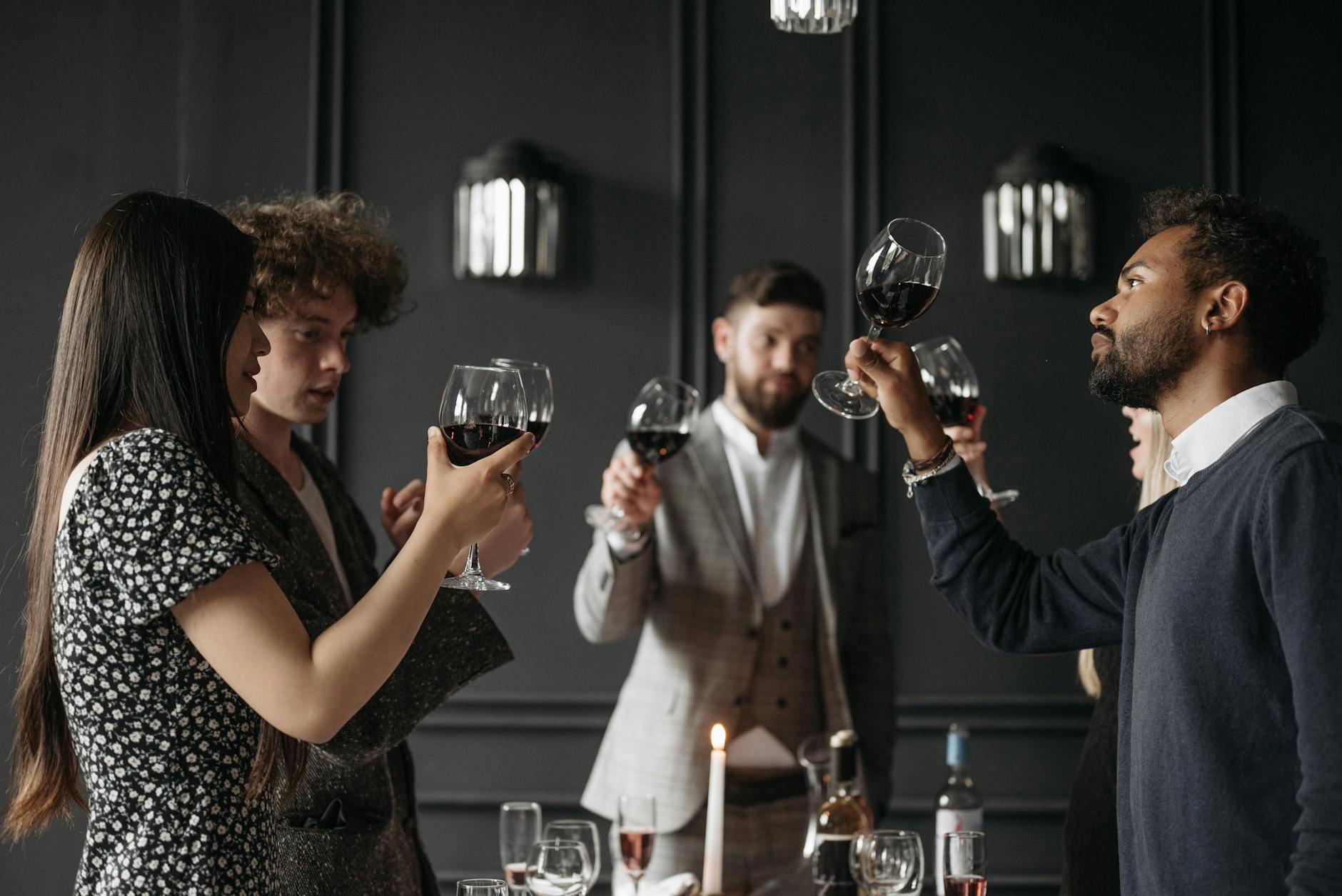 family making a toast on a dinner