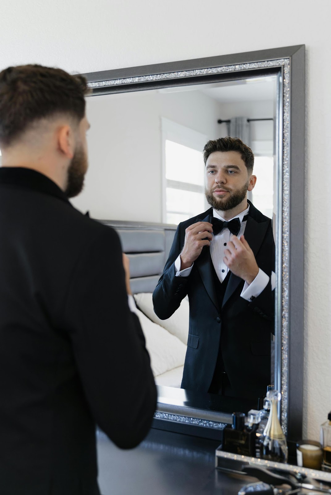 men getting ready before tuxedo