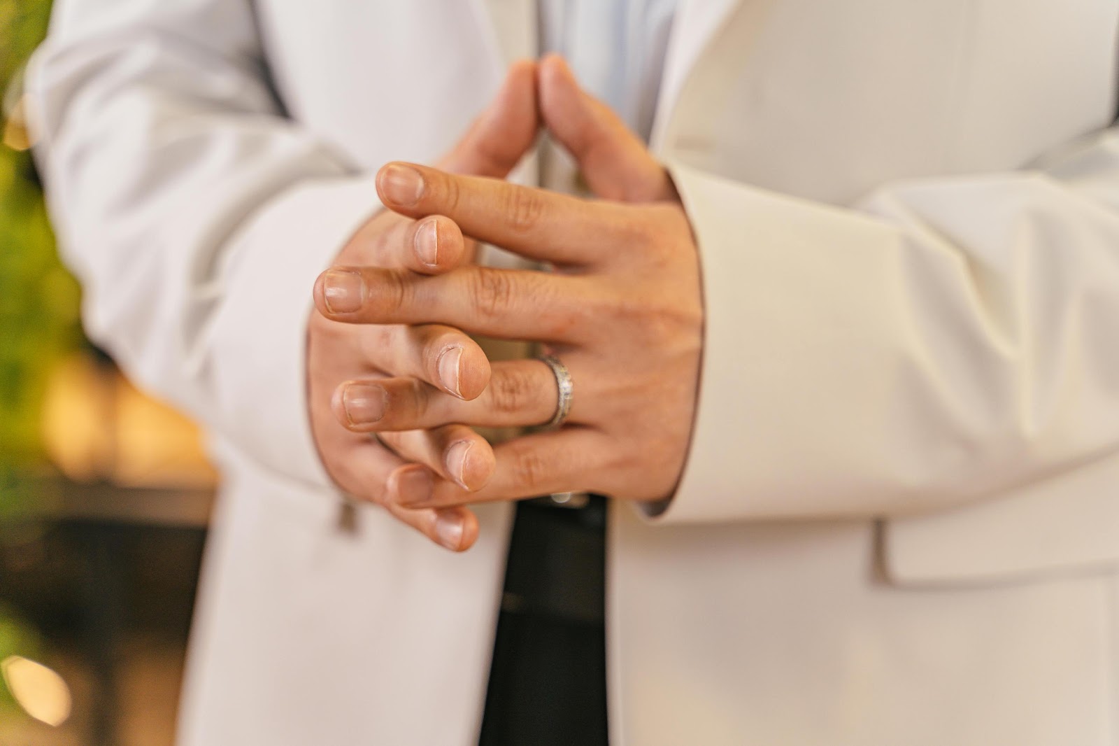 Men wearing engagement ring in party