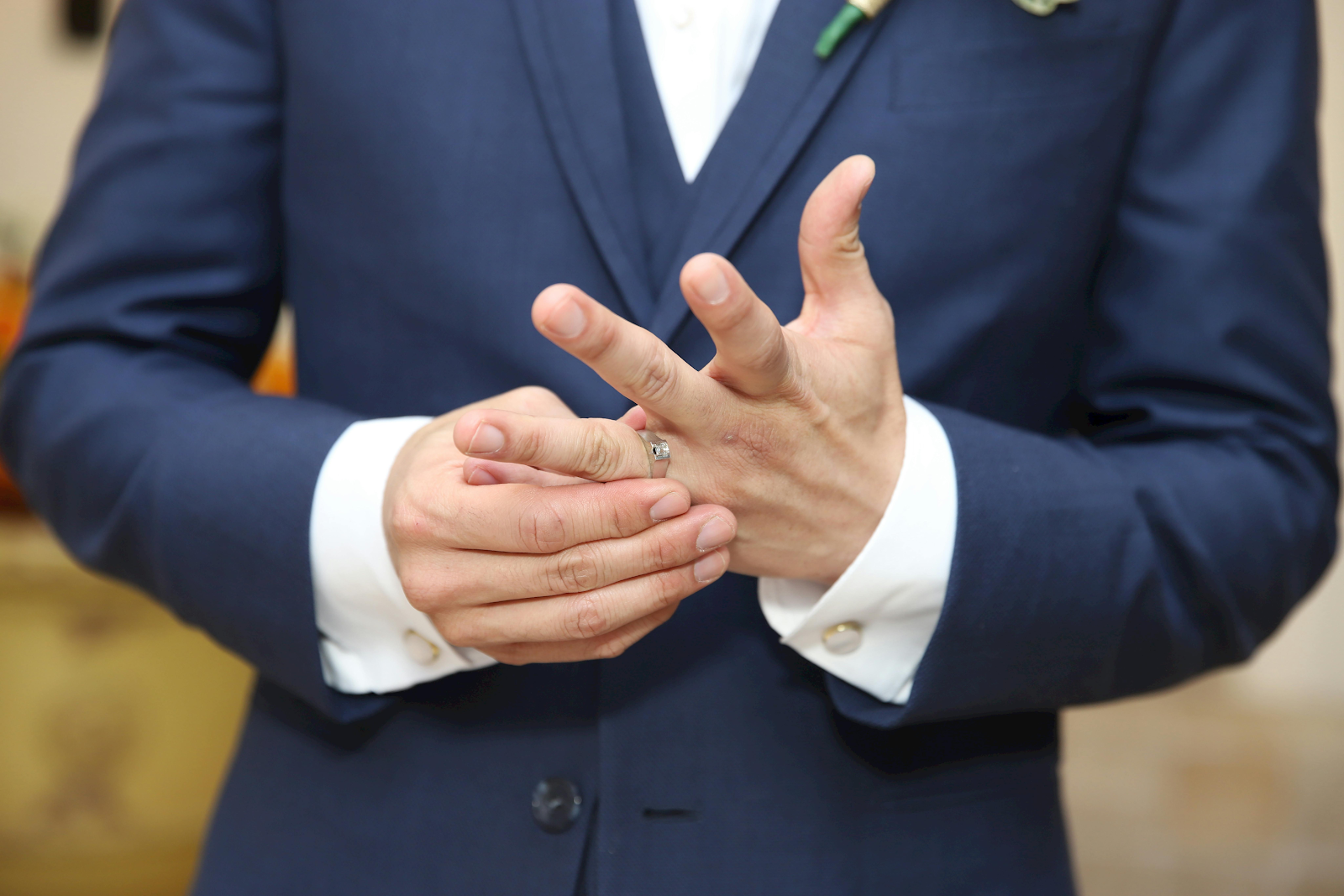Men wearing engagement ring in formals