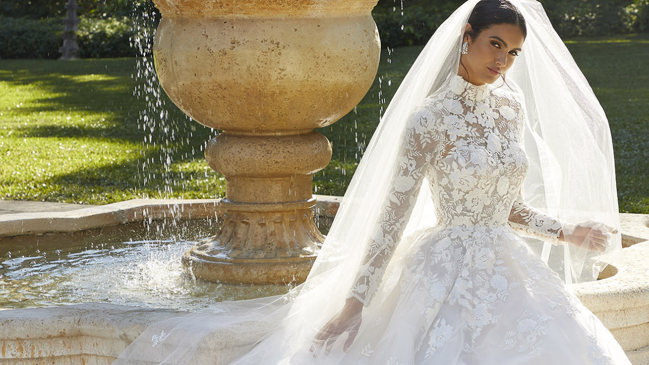 Elegant bride wearing a halter gown paired with a stunning earring and necklace set, showcasing how the right earring necklace sets wedding combination perfectly complements high necklines for a sophisticated bridal look.