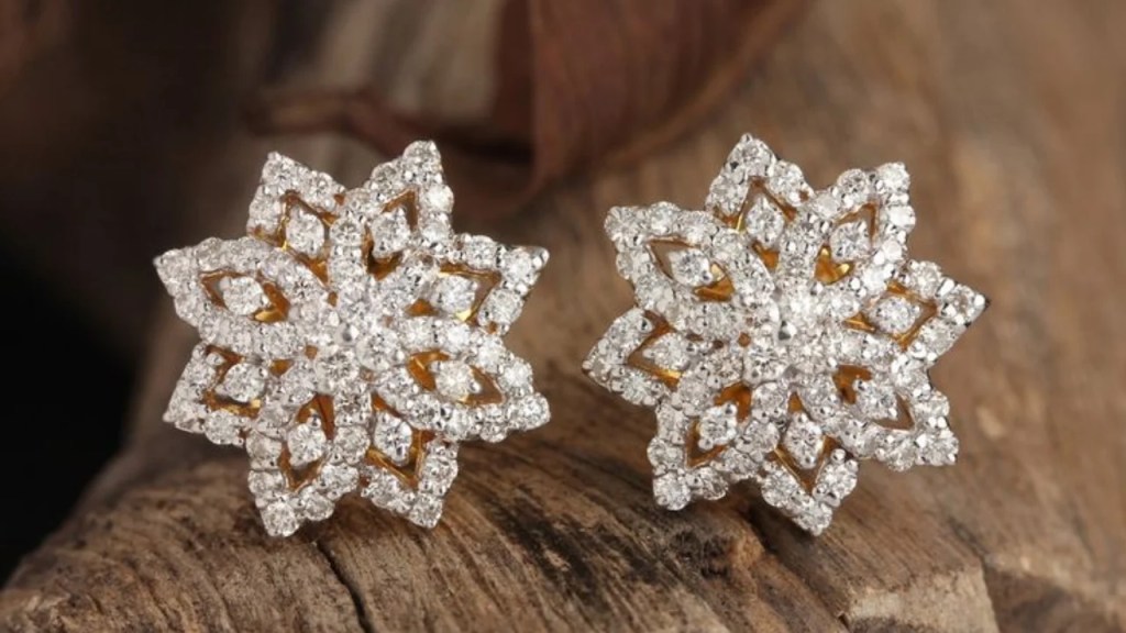 A pair of elegant, minimalist stud earrings featuring a sleek and simple design, crafted from polished metal with a subtle, modern finish. Perfect for everyday wear or adding a touch of understated style to any outfit.