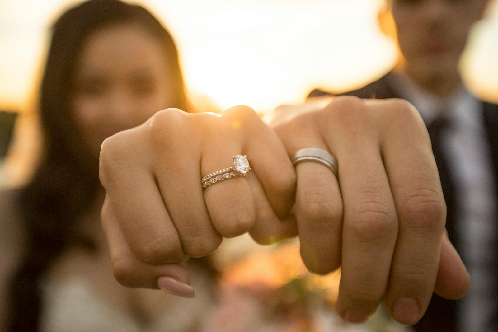 men and women showing their ring