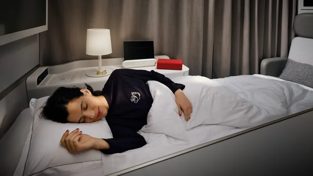 A picture of a women wearing Jacquemus Fancy First-Class Pajamas in air France airline