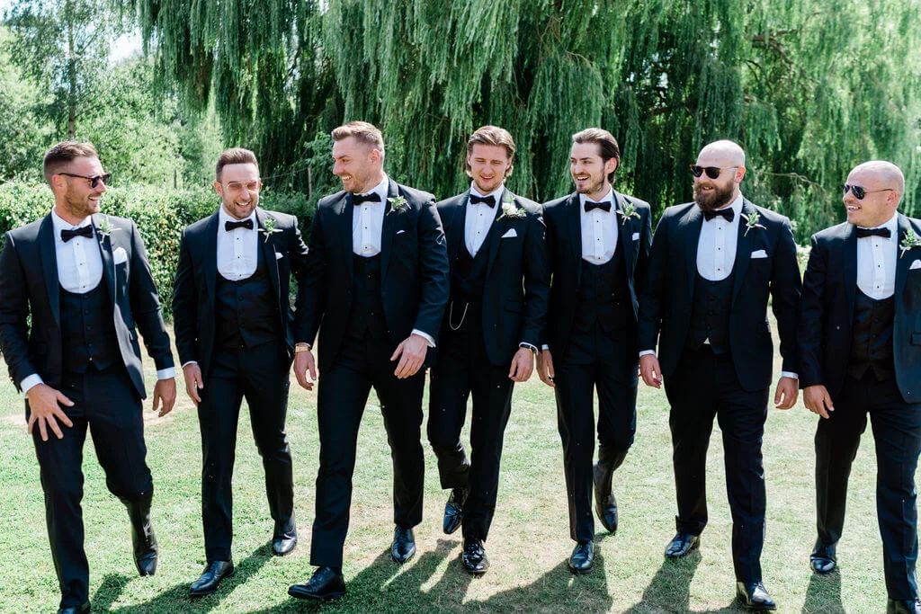 men in wedding tuxedo with bow