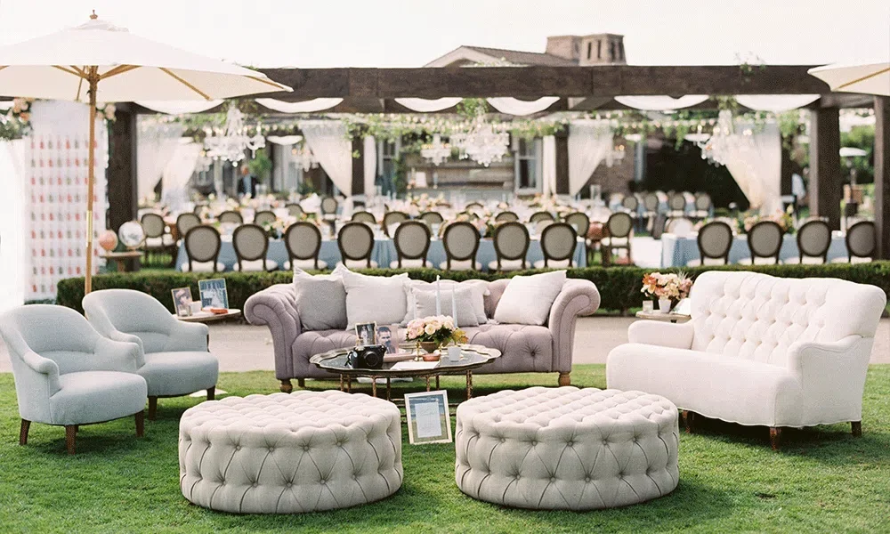 Elegant Create a Cozy Lounge Area featuring plush seating, soft lighting, and decorative accents, perfect for wedding reception decorations on a budget, creating a warm and inviting atmosphere for guests to relax and socialize.