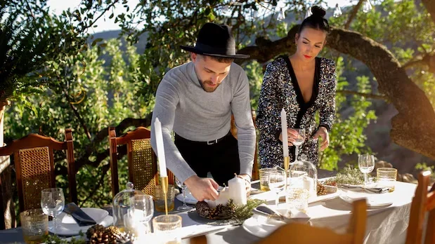 men decorating wedding table