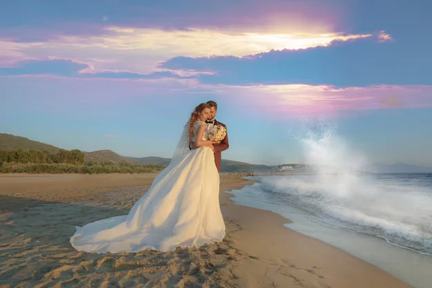 couple in beach in wedding costume
