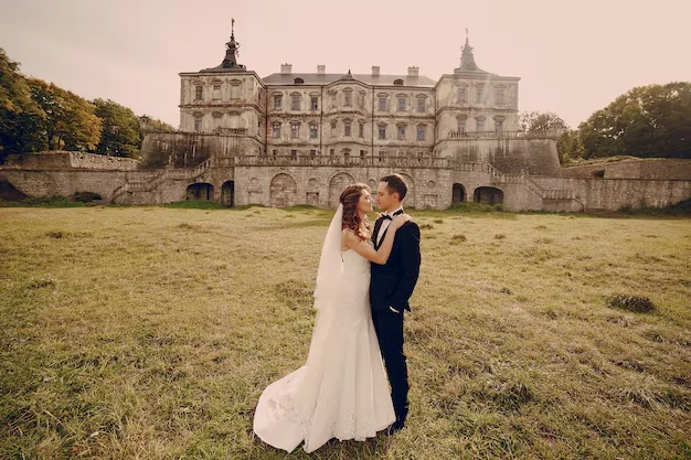 wedding couple in front of historic castle