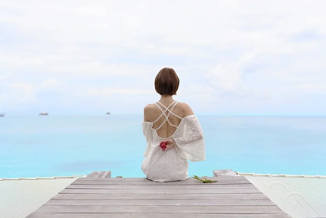 women wearing white dress